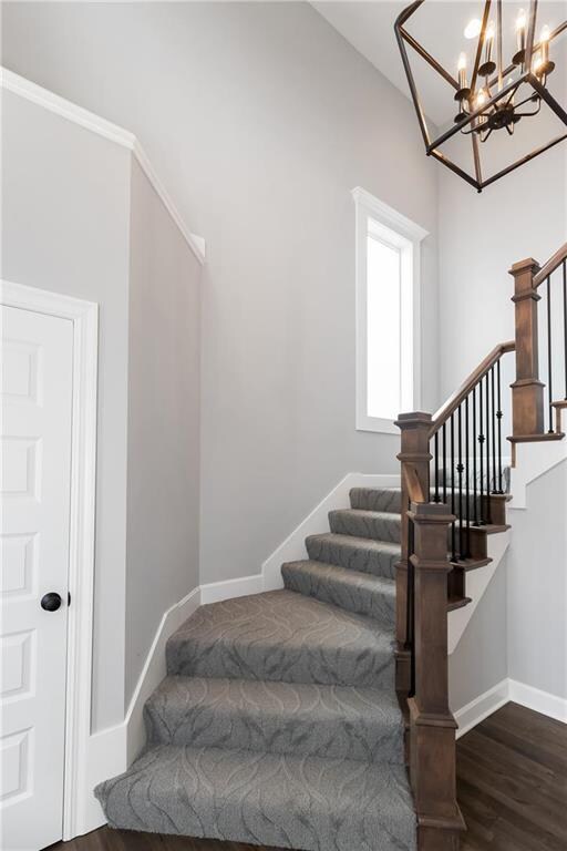 Dramatic entry with stunning staircase. Designer c