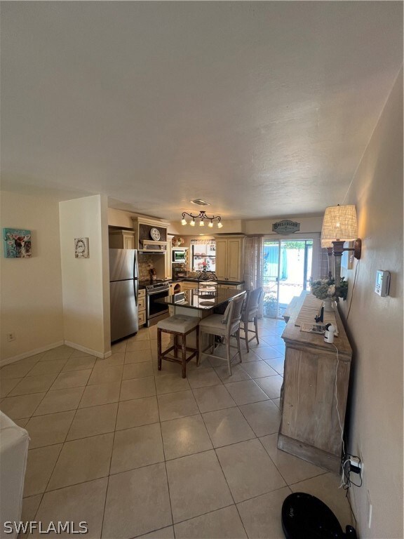 Dining space with light tile floors