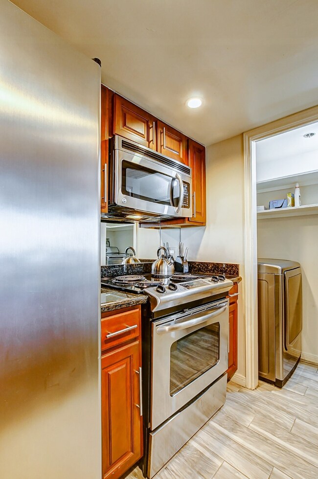 The galley kitchen offers stainless steel applianc