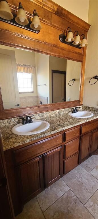 Bathroom with dual bowl vanity and tile floors
