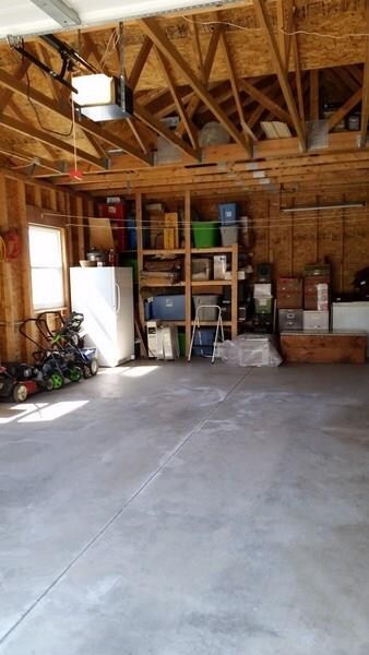 Garage is extra deep and offers tons of storage pl
