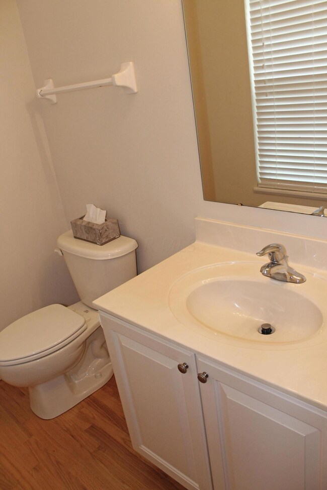 Powder Room with hardwood floor
