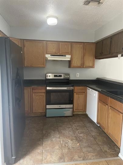 Kitchen featuring stainless steel range with elec