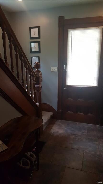 Pretty staircase and natural woodwork throughout