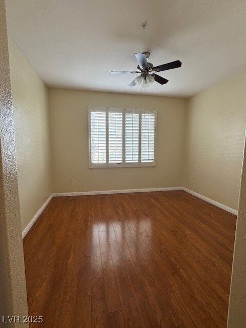 Unfurnished room with wood-type flooring, ceiling