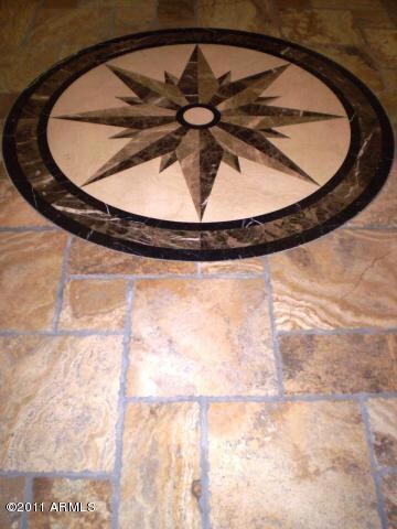 ENTRY MEDALLION AND TRAVERTINE FLOORS