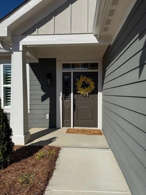 Entrance to property with a porch