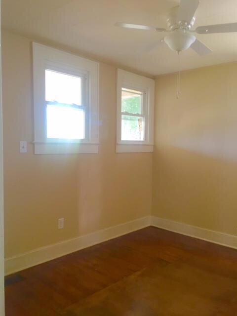 Bedroom with high windows for easy placement of furniture