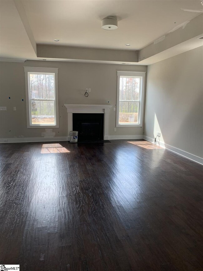 Great room with tray ceiling and added fireplace p