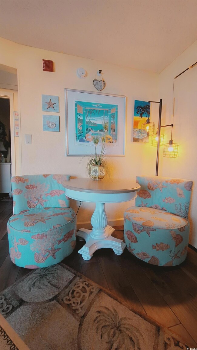 Sitting room featuring hardwood / wood-style flooring