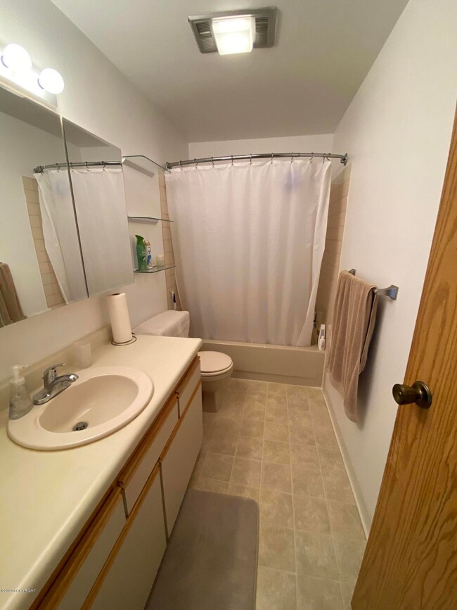 A full bath with tub and shower