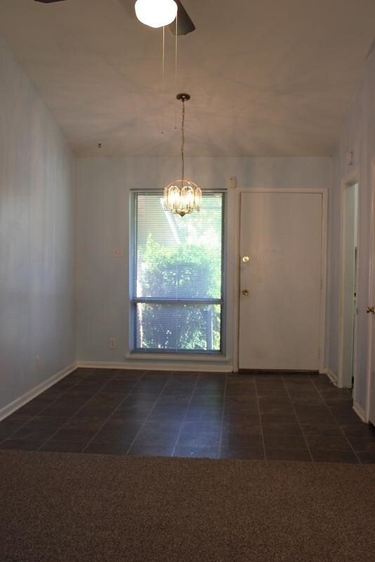 Vaulted ceilings add height and dimension to the spacious family room.