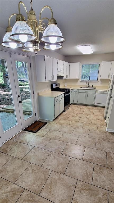 Kitchen featuring decorative light fixtures, dishw