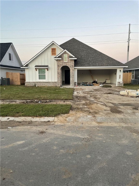 View of front of house featuring board and batten