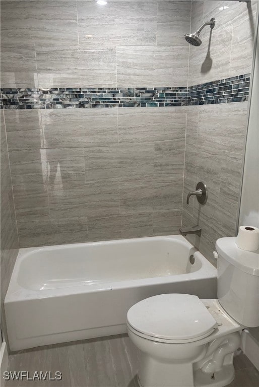 Full bath with shower / washtub combination and wood finished floors
