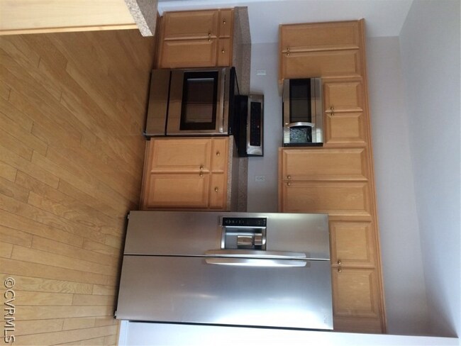 Kitchen includes hardwood floors and stainless ste
