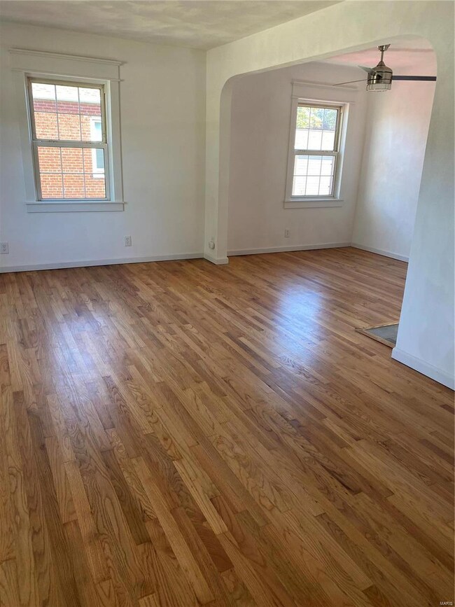 Living & Dining Room. New plastered walls and refinished oak floors.