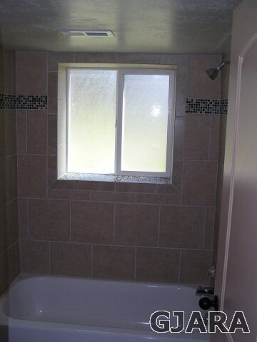 Tiled Shower, Cast Iron Tub, Tile Floor, New Fixtu