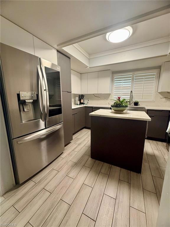 Kitchen featuring crown molding, wood tiled floor,