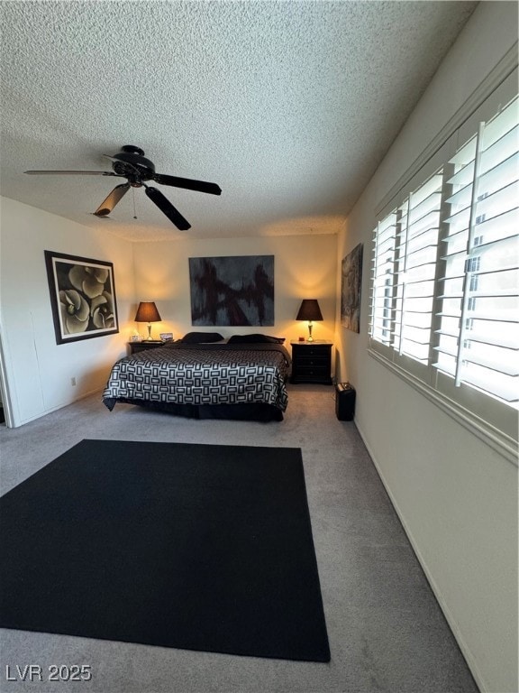 Carpeted bedroom and a ceiling fan