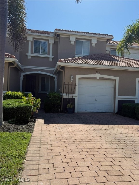 View of front of property with decorative driveway