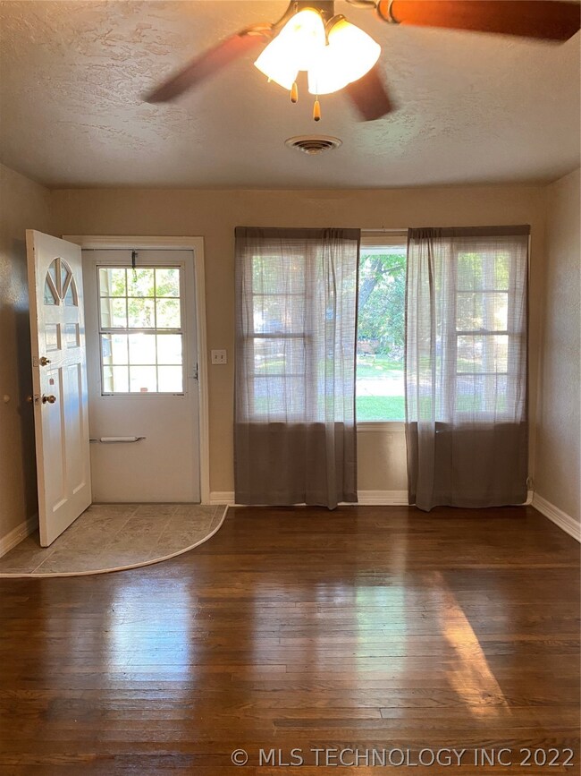 FRONT OF THE LIVING ROOM. WINDOWS ALL THE WAY ACRO