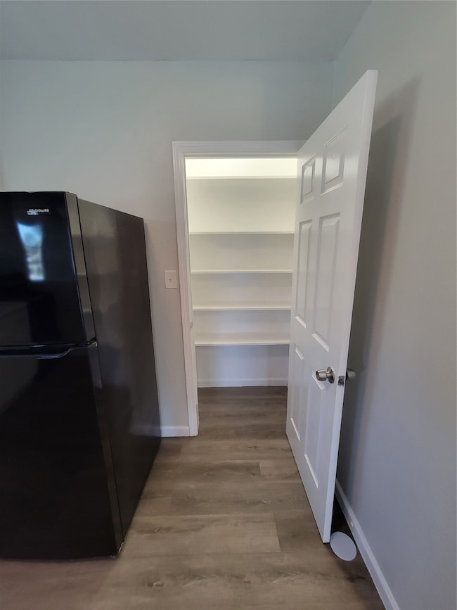 Lighted pantry provides extra storage space.