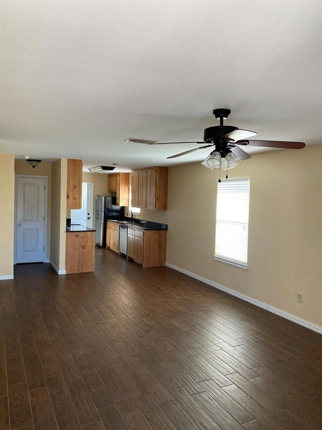 Kitchen with dark hardwood / wood-style flooring, 