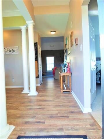 Extra wide entry way with secondary bedrooms to ri