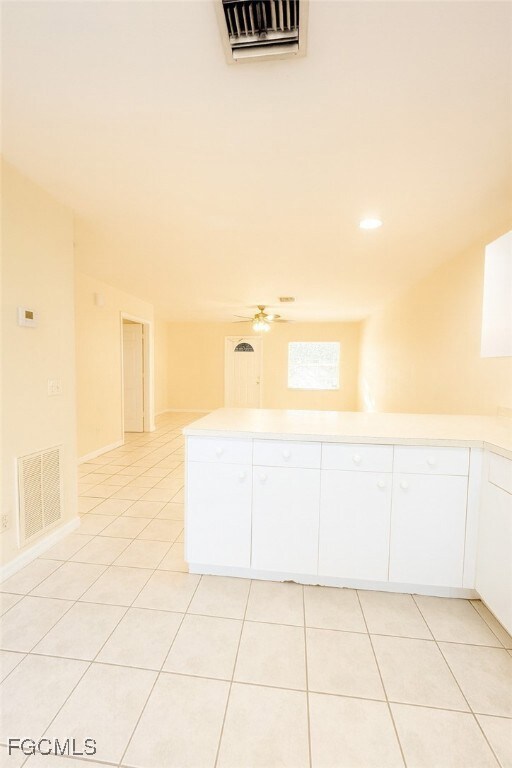 Unfurnished room with light tile patterned floors, recessed lighting, and a ceiling fan