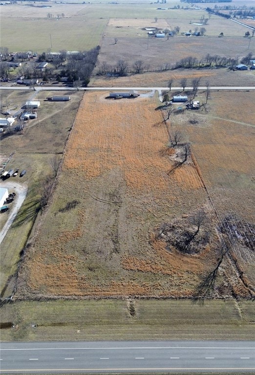 A portion of a larger tract 3.38 ac mol facing highway 412. Does NOT go south of the notched fence area.