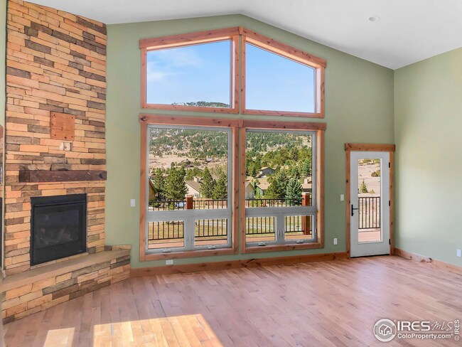 Large floor to ceiling fireplace and view windows