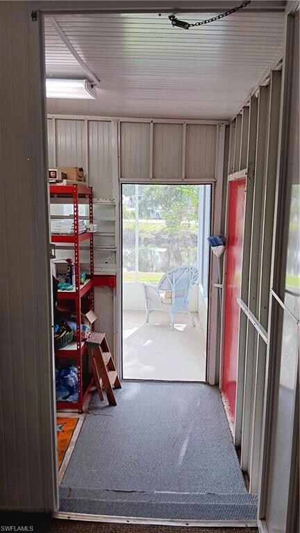 View of doorway to storage room and lake view back Lanai