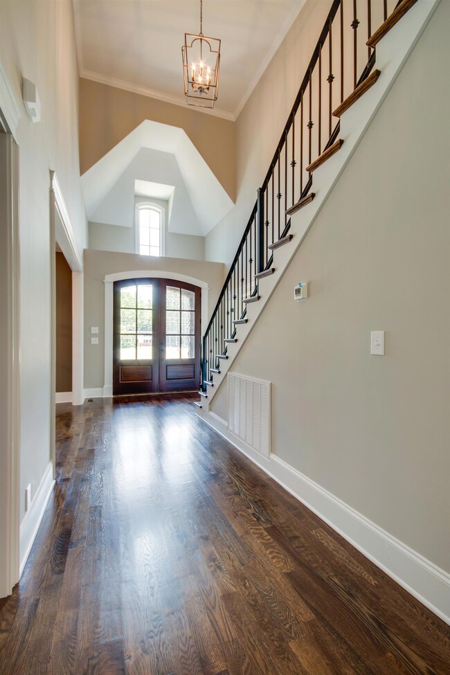 Regal entrance into this grand brick home
