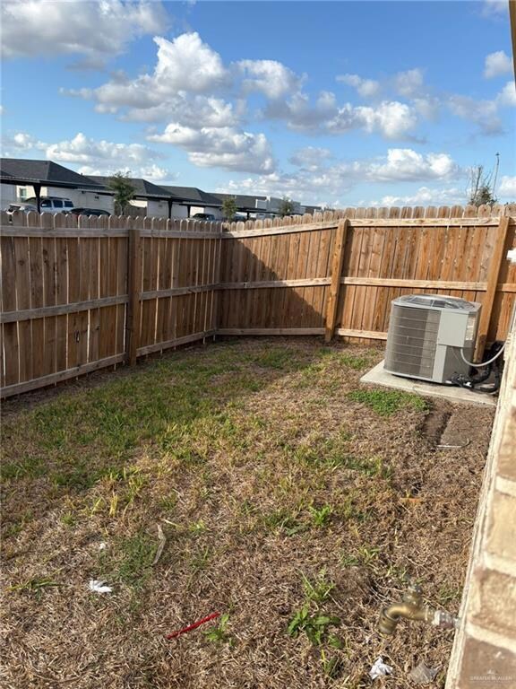 View of fenced backyard