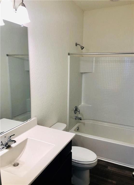 Bathroom with wood finished floors, vanity, and  