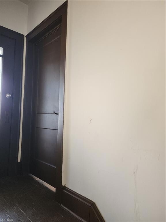 Hall featuring dark hardwood floors