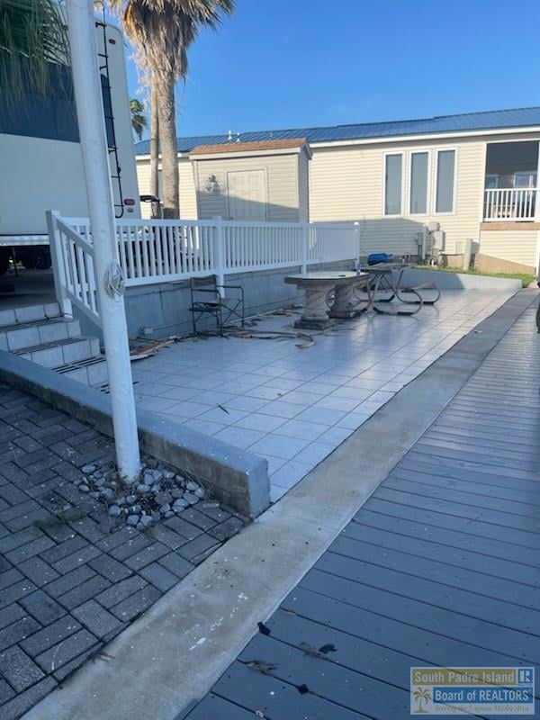 Extended tiled patio area