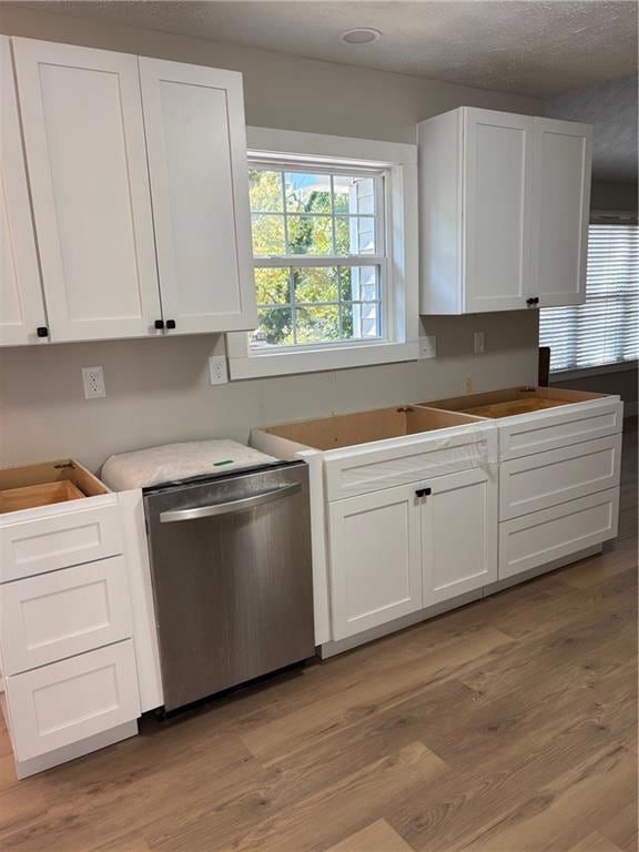 A work in progress, the kitchen has all new cabinetry granite cabinetry, backsplash, stainless steel sink.
