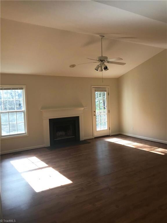 Greatroom with vaulted ceiling and fireplace