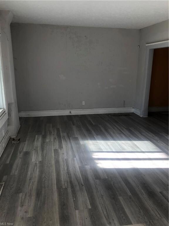 View of wood floored spare room