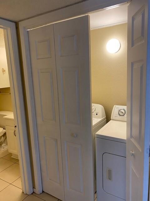 Laundry closet in hall hold full size washer and d