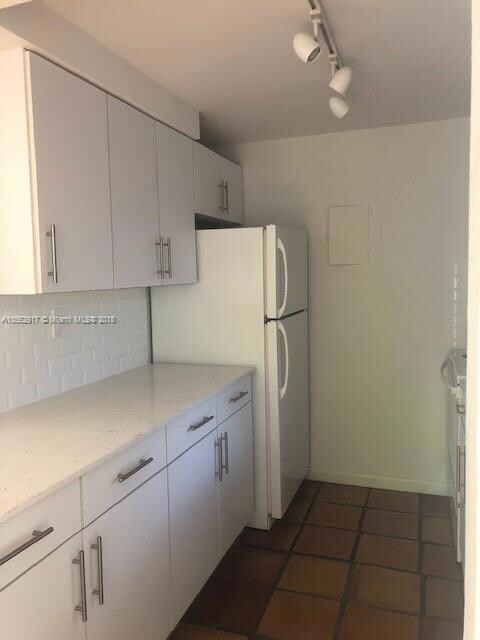 NEWLY RENOVATED KITCHEN WITH NEW CABINETS, APPLIANCES AND TRACK LIGHTING