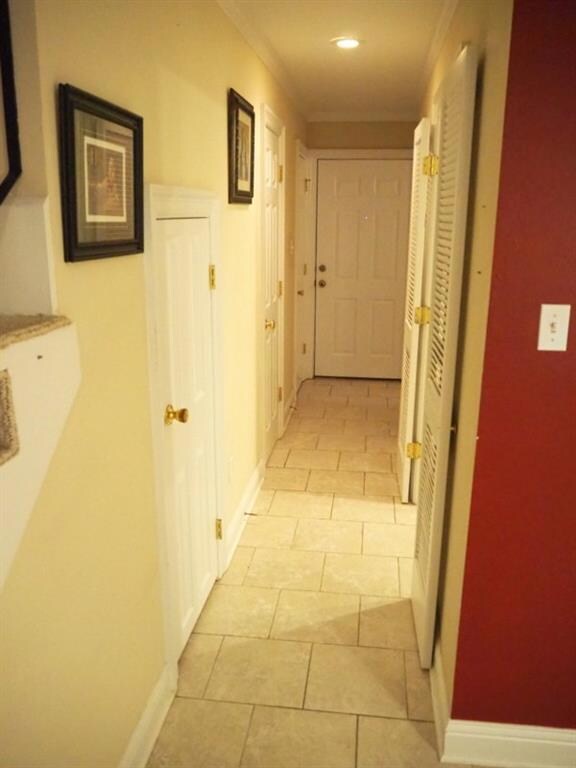 Hallway leading Kitchen, Half Bath, Washroom and E