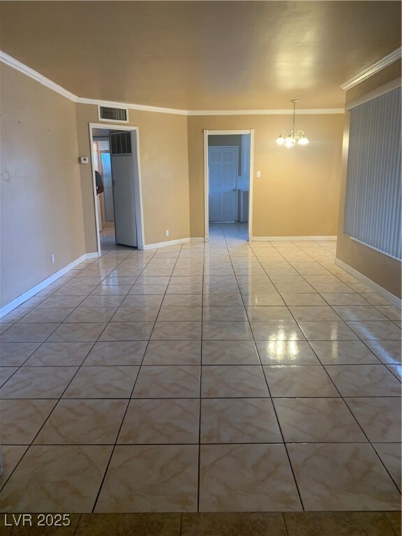 Unfurnished room with visible vents, baseboards, a