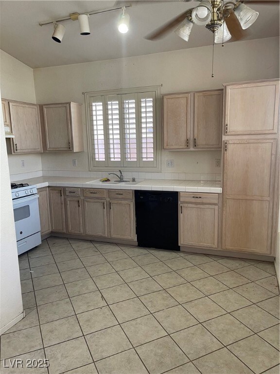 Kitchen with ceiling fan, paneled dishwasher, stov