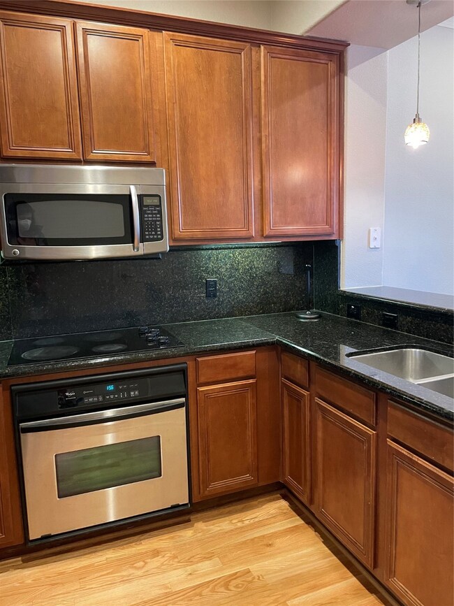 Plenty of cabinets, granite countertops