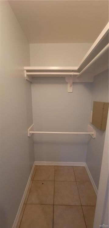Spacious closet with tile patterned floors