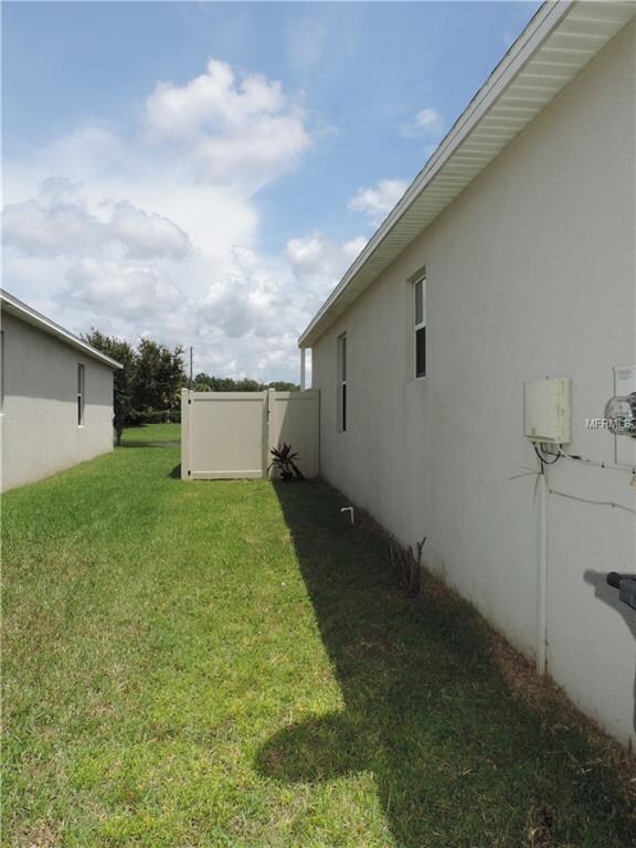 Side yard with view of privacy fence