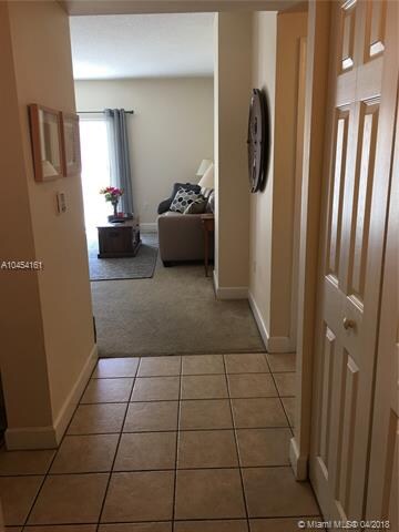 Foyer. To the right  there is a  spacious utility 